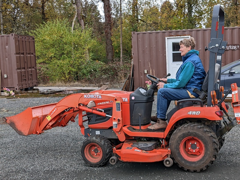 Laura driving the tractor.