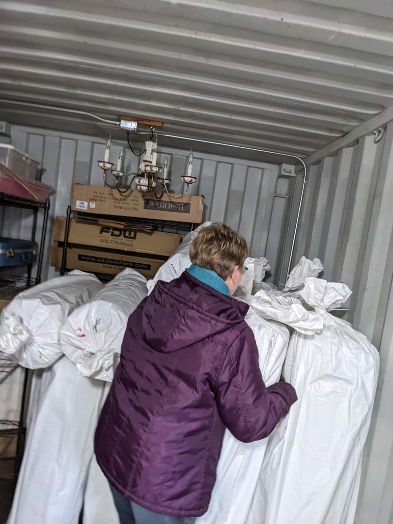 Laura putting new mattresses into LoCon.