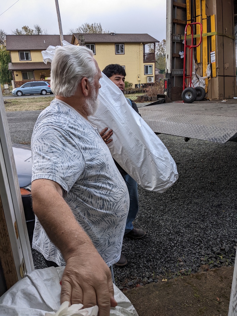 Don and workers unloading the delivery truck.