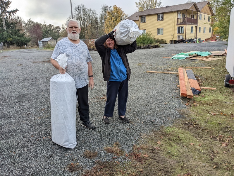 Don and Lois taking mattresses to B4 and B6.