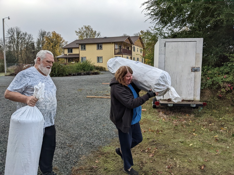 Don and Lois taking mattresses to B4 and B6.