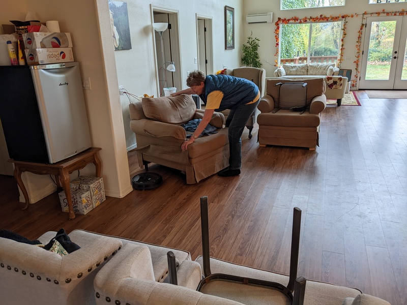 It was raining so Laura cleaned indoors.