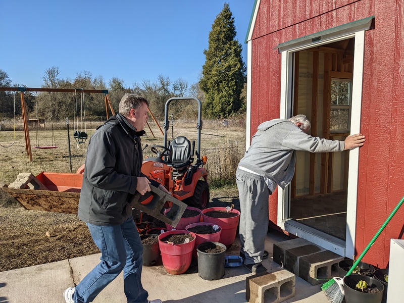 Joseph and Don making a step out of concrete blocks.