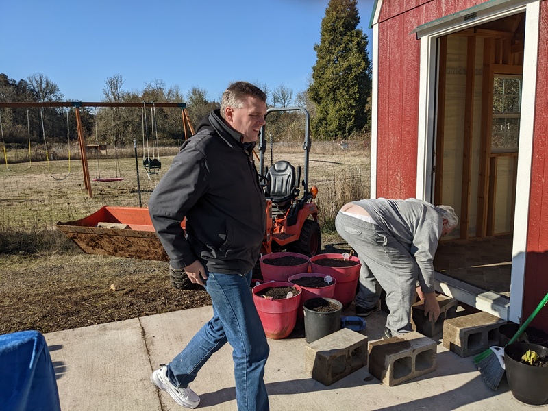 Joseph and Don making a step out of concrete blocks.