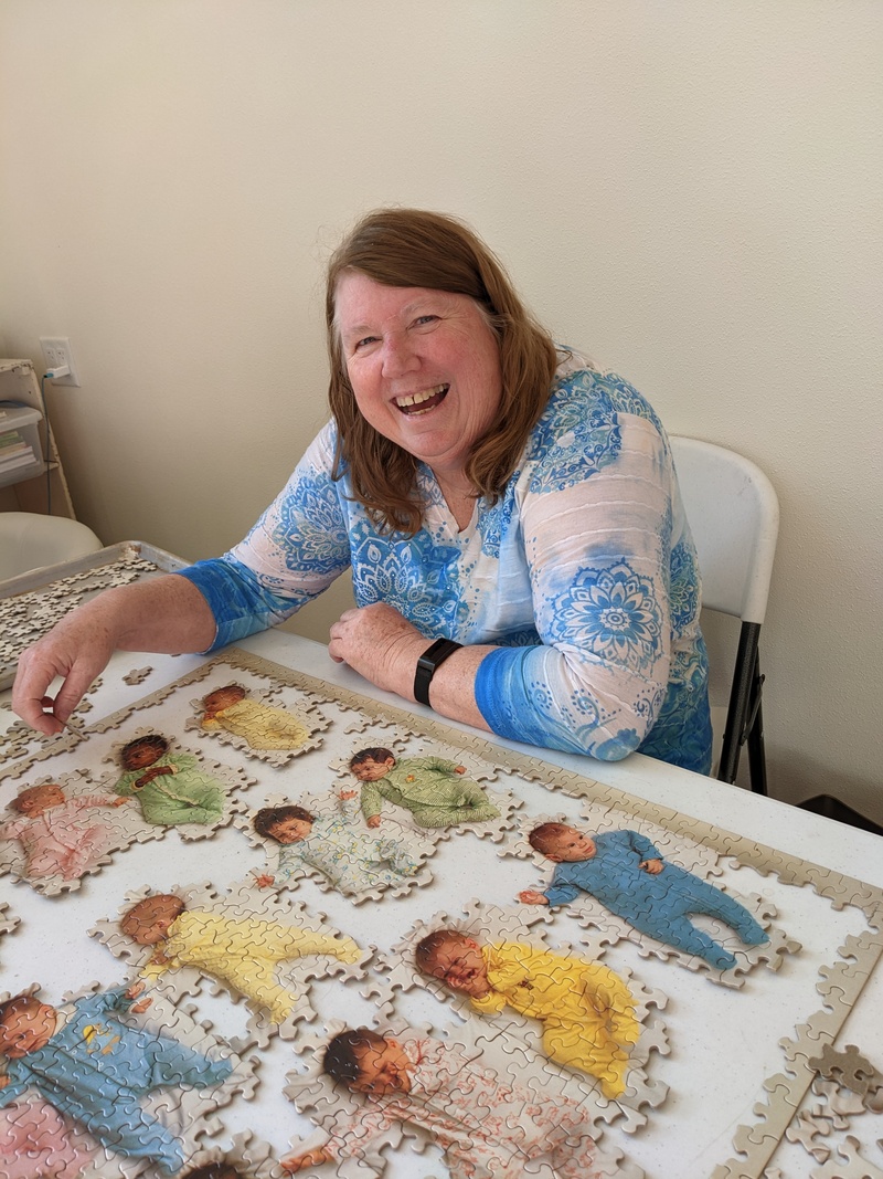 Lois working on the babies puzzle.