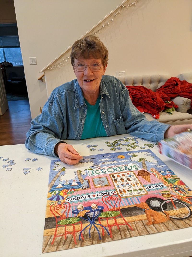 Laura working on a puzzle.