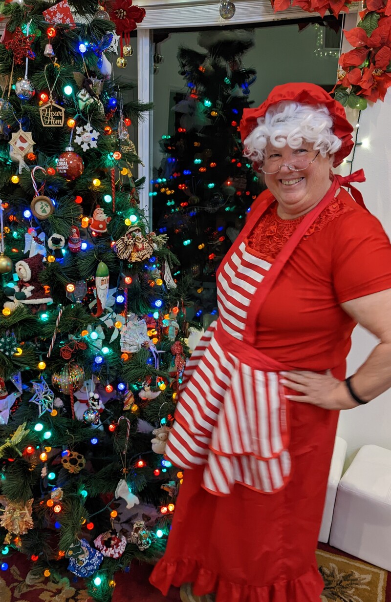 Mrs Claus at the tree.