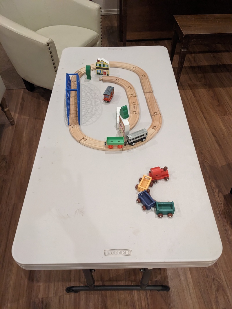 Trains. Wooden set on the small table.