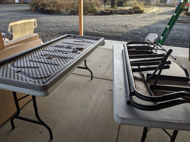 Lois and Don assemble picnic tables.