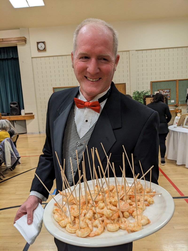 The Hand of God: Matt Garzenelli serves shrimp.