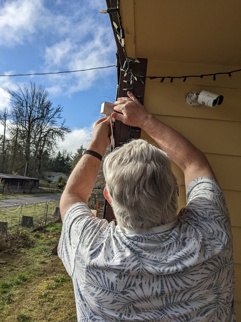 Don installing a new outdoor camera.