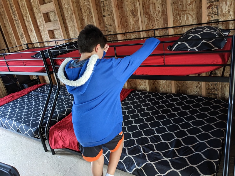 Kekoa demonstrates how easily he can get into the top bunk.