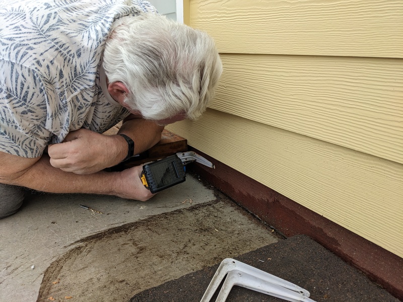 Oh, he's putting a stability bracket on the steps.