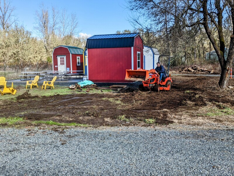 Joseph doing Firepit Garden cleanup and leveling.