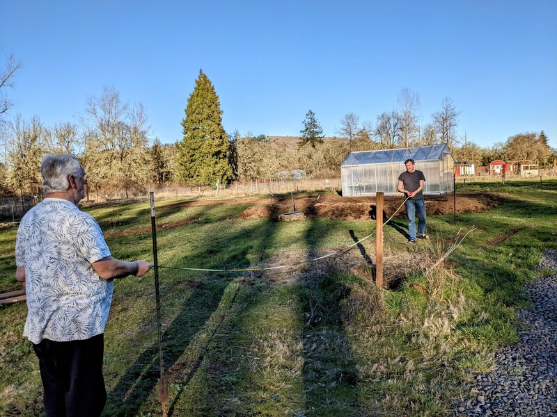 Don and Joseph talking about blacksmith plans.