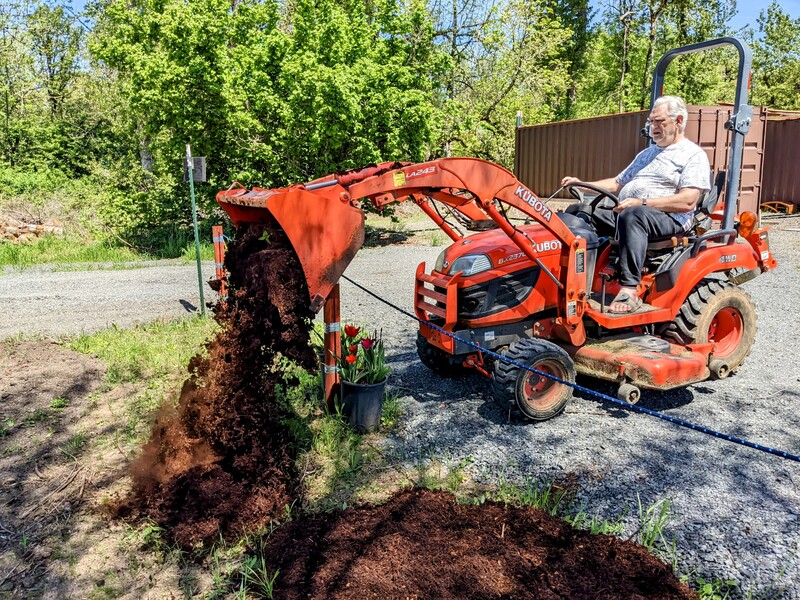 Don laying the bark down.