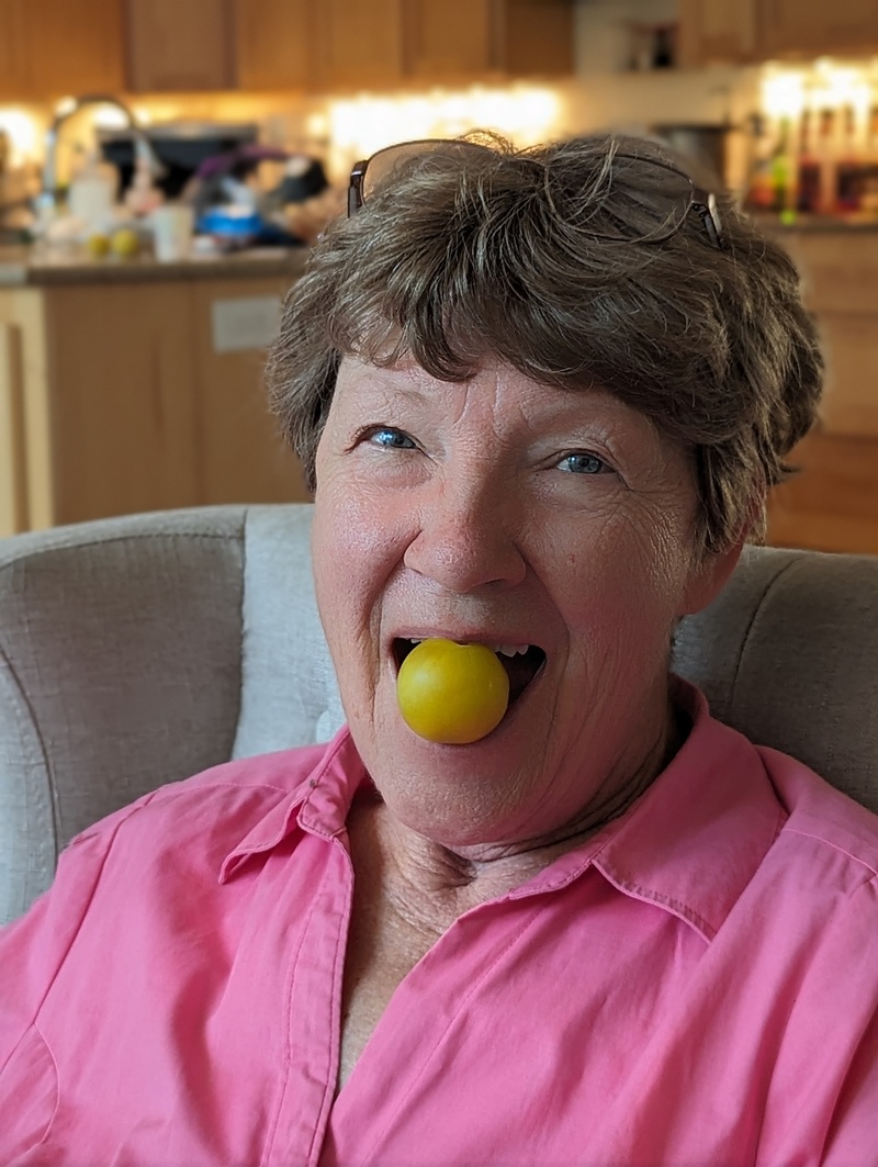 Laura eating one of our plums.