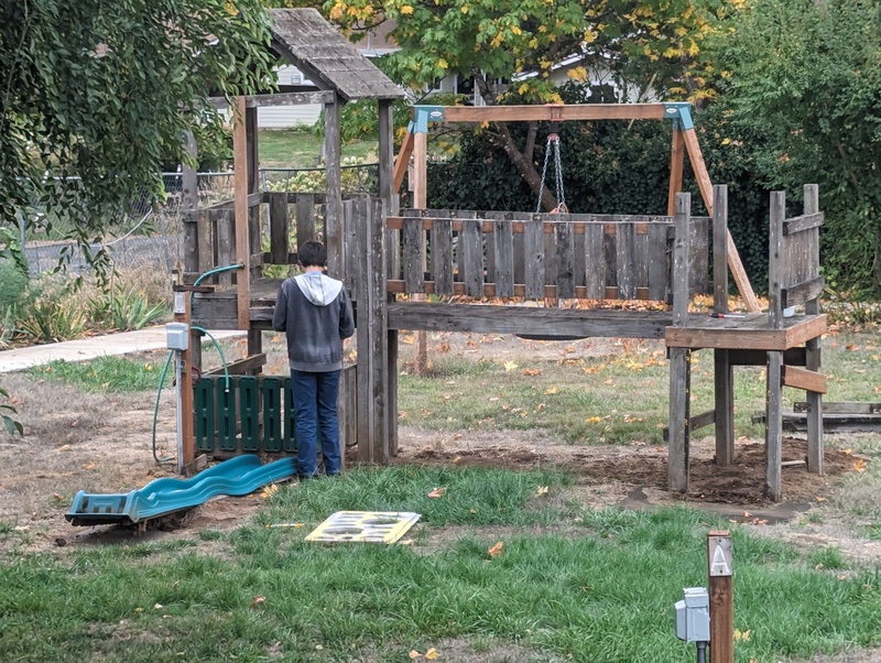 Alex started taking down our old play structure.  It suffers from rotting wood.