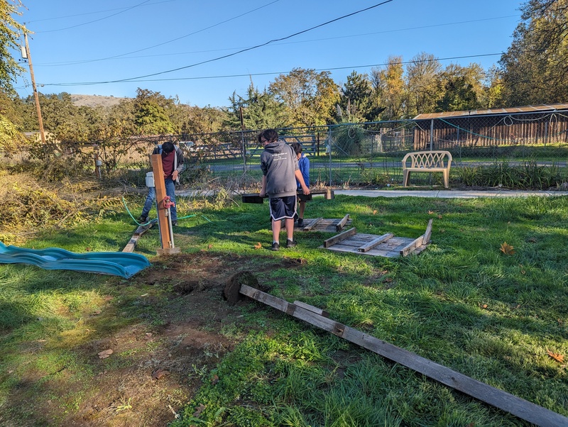 Removing the old play structure debris