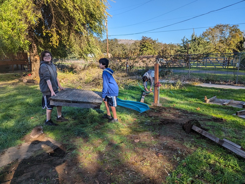 Removing the old play structure debris