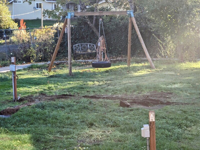 Removing the old play structure debris. And now it's done.