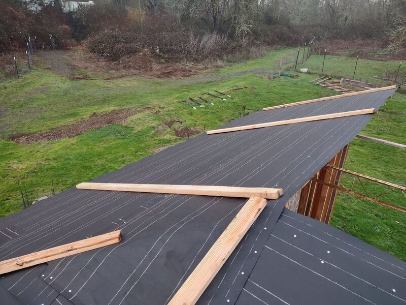 Joseph put up roofing paper.