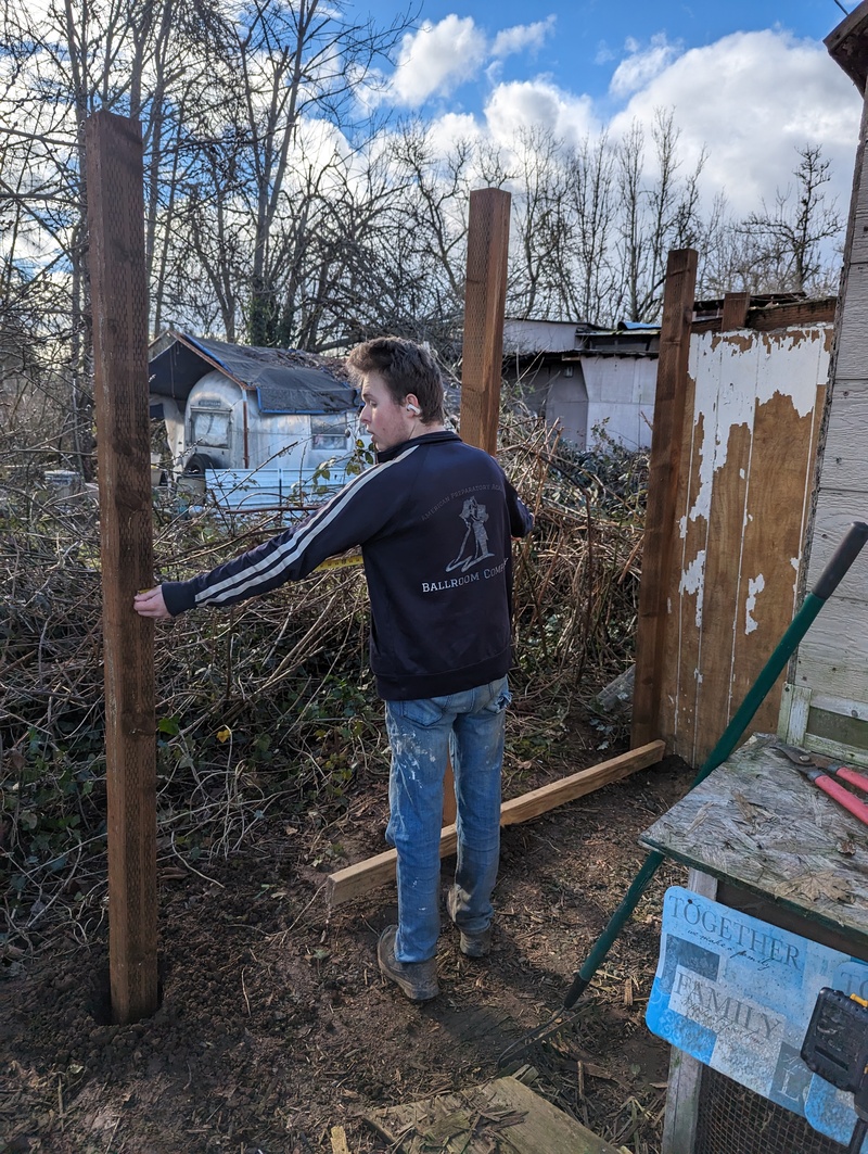 Chicken Coop Expansion. Caleb measuring the distance