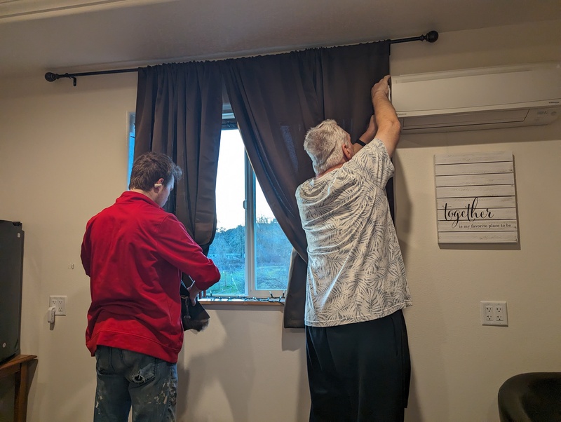 Caleb and Don working on drapes.