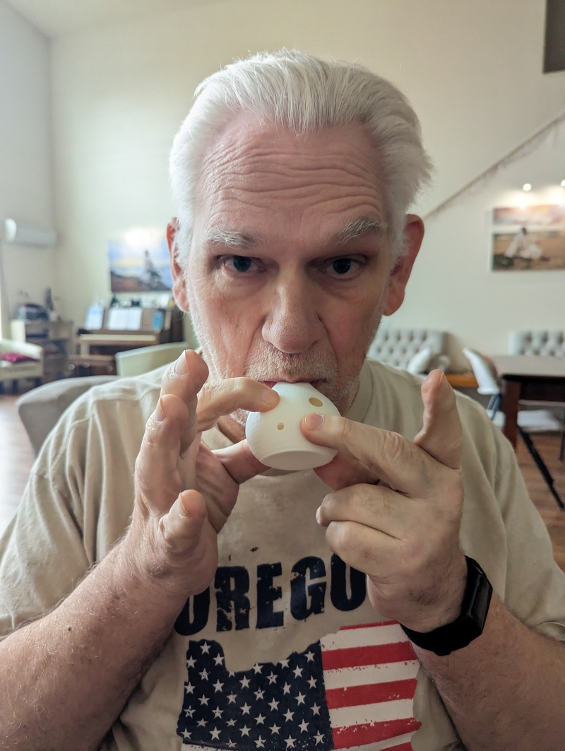 Don experimenting on the first ocarina.