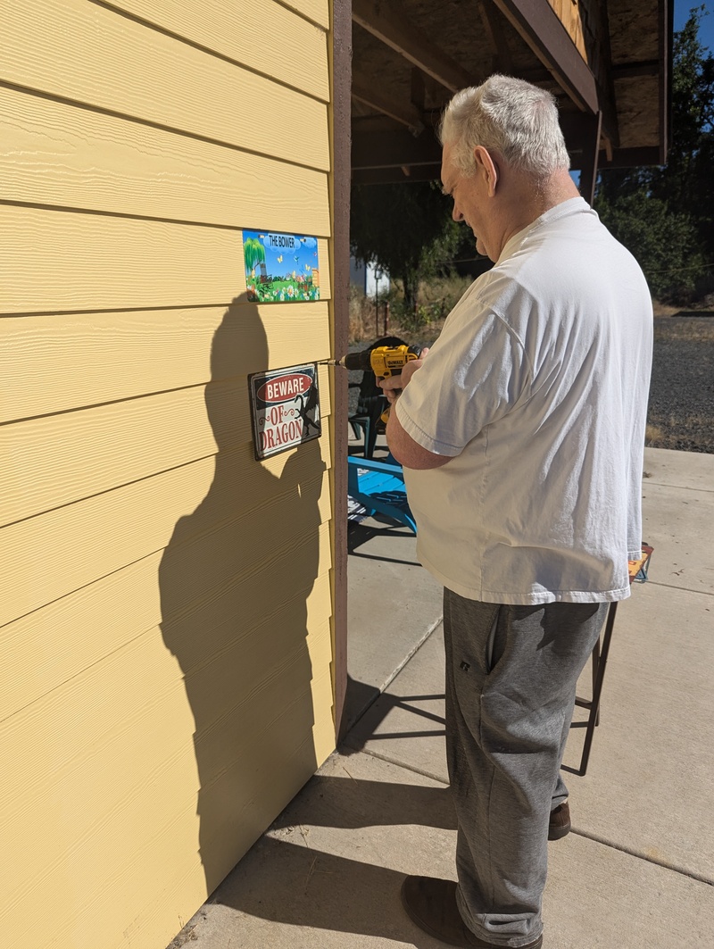 Don installing Dragon Warning signs