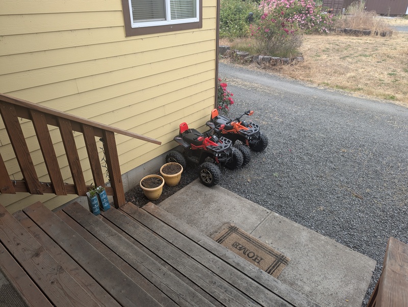 4 wheelers parked in front of the house.