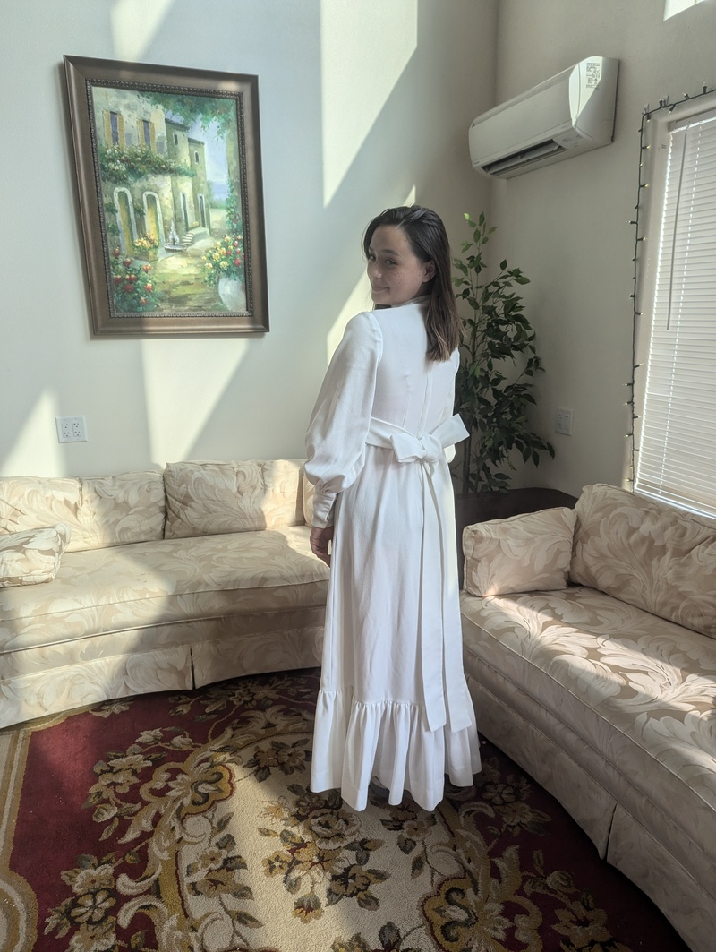 Tia wearing Lois's wedding dress