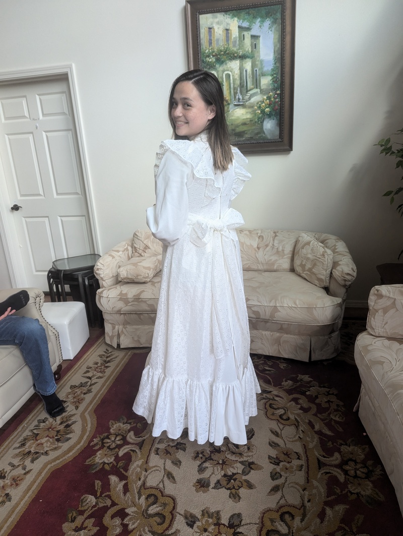 Tia wearing Lois's wedding dress