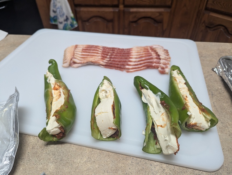 Lois has been on a kick to make "Texas Twinkies" that she has never eaten. The first time she wrapped bacon around jalapeno poppers stuffed with cream cheese and meat. This time she wrapped bacon around Anaheim peppers. They are still too spicy for her.