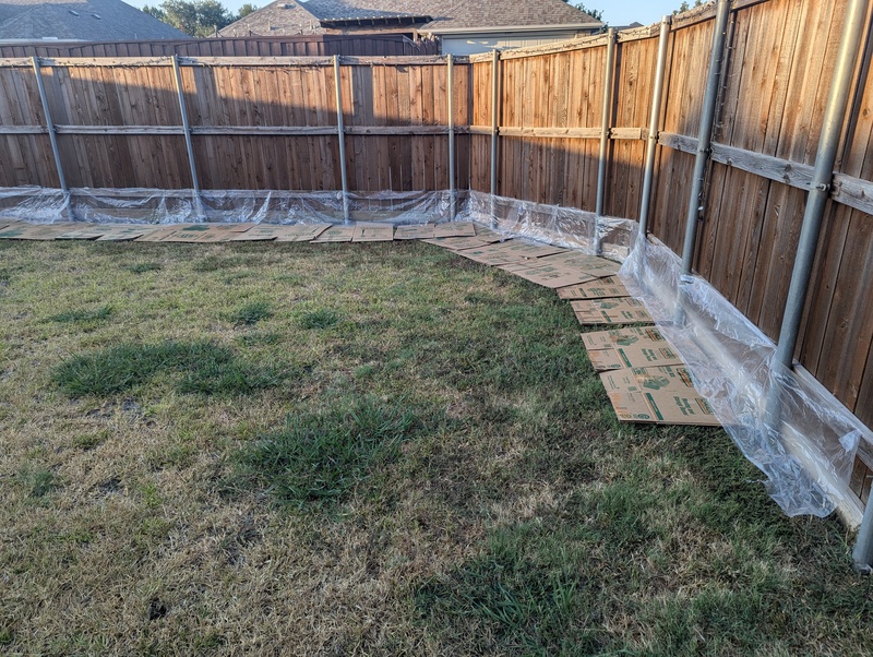 Lois attached plastic on the fence to protect it from dirt.