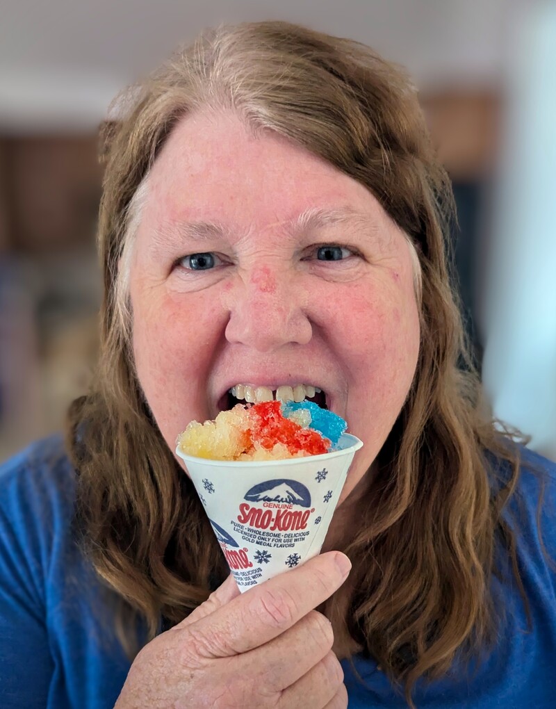 Lois celebrates the Ice Cream social with a shave ice (snow cone).