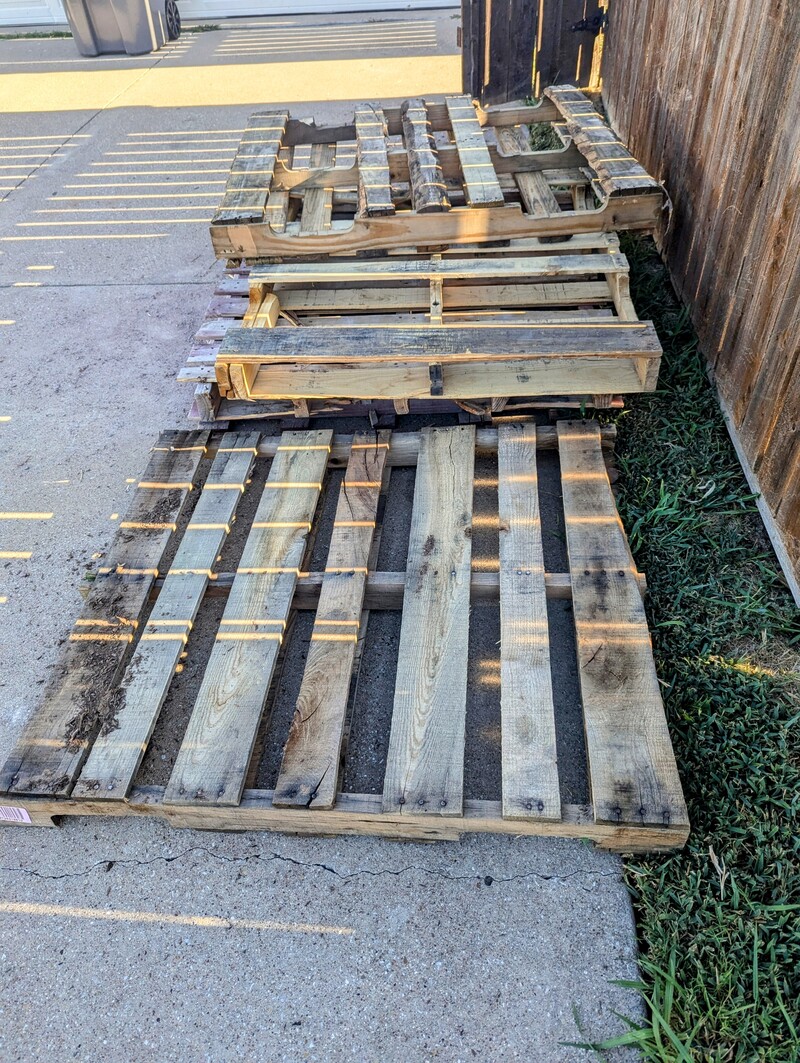 Five free pallets that used to have lawn edging bricks and dirt