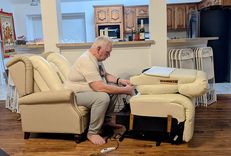 Don is hooking up all the wires to his new chair.