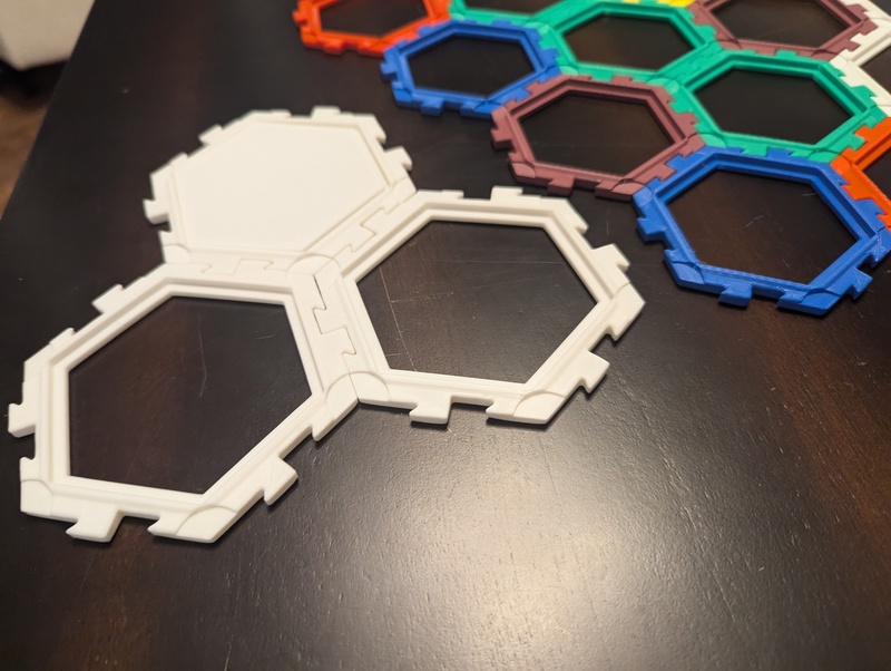 Catan interlocking tile frames. Full-sized group of three. 80% sized beyond.