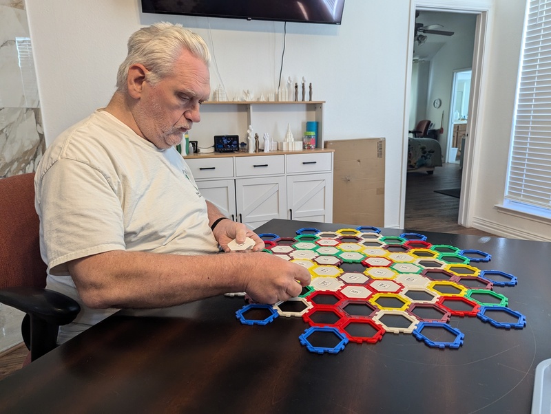 Don gearing up for round two with improved game pieces. Lois won this round.