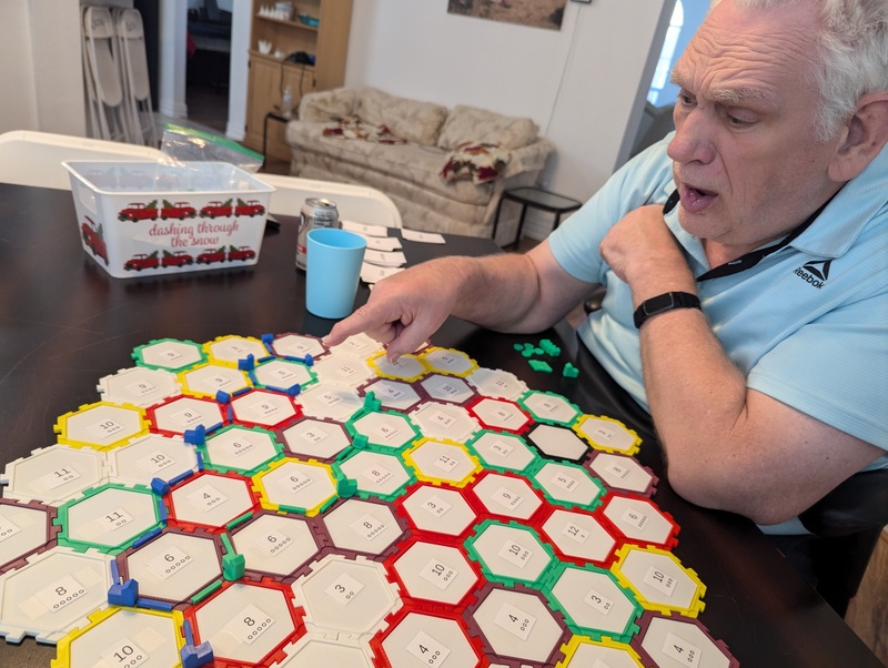 Another game of Catan. Don was impressed with my longest road.. But he kept pushing me to have to go longer. 🤣  Paper numbers version two taped to hex tiles.