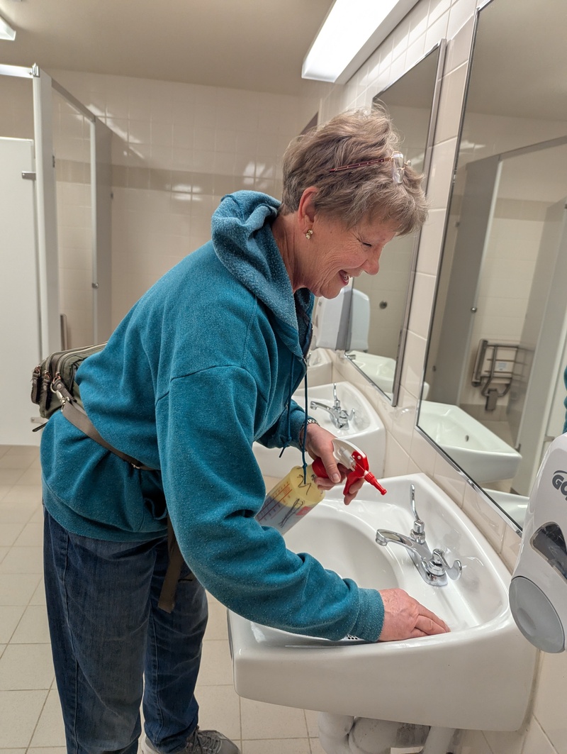 Laura Neilson having too much fun cleaning a bathroom sink at our church building.