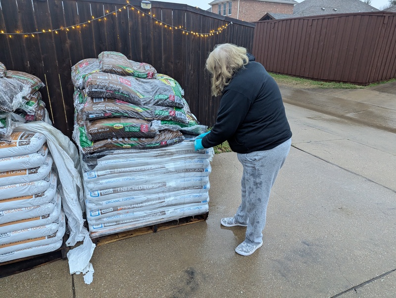 The bags of bark and dirt are here.