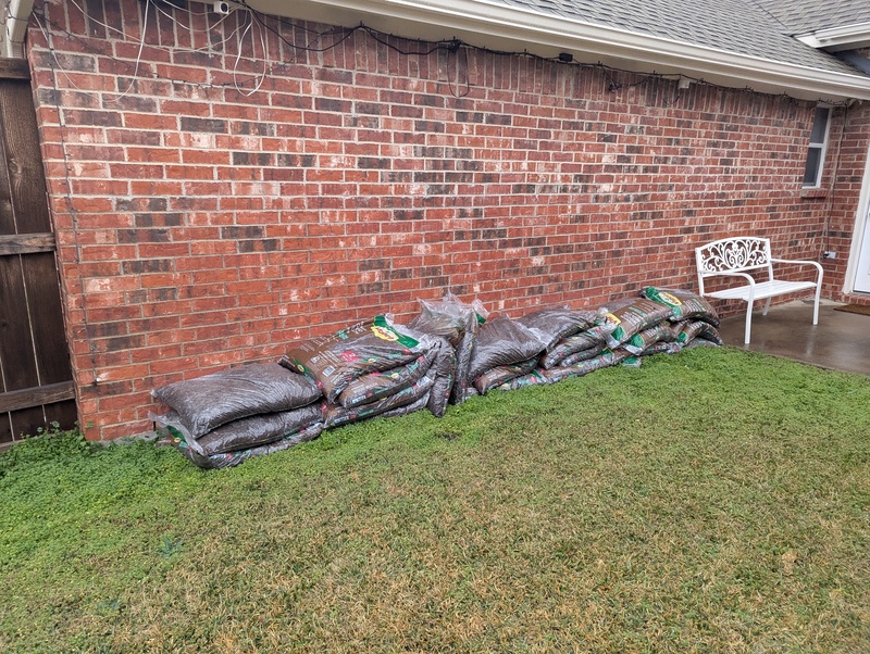 Bark bags inside the fence.