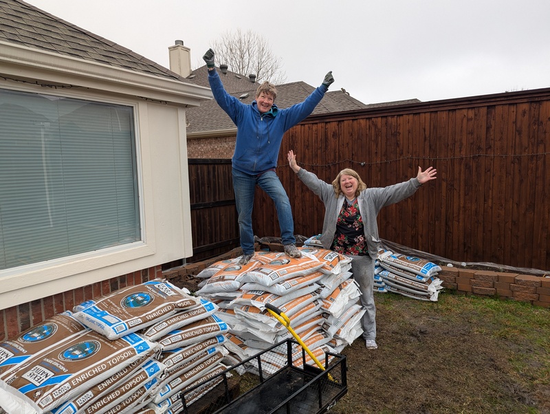 Dirt successfully moved inside the back yard.