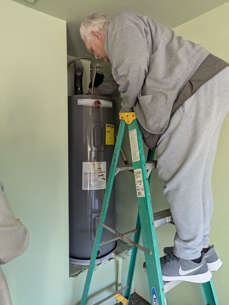 Don working on the water heater.