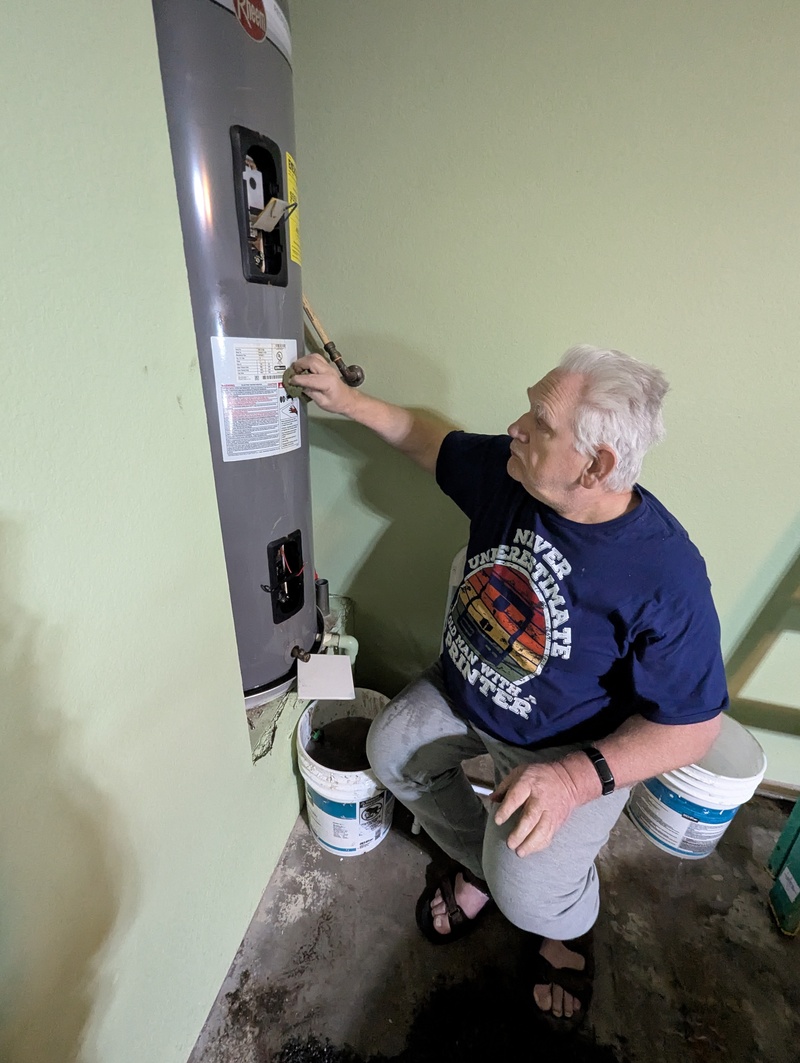 Don working on the water heater.