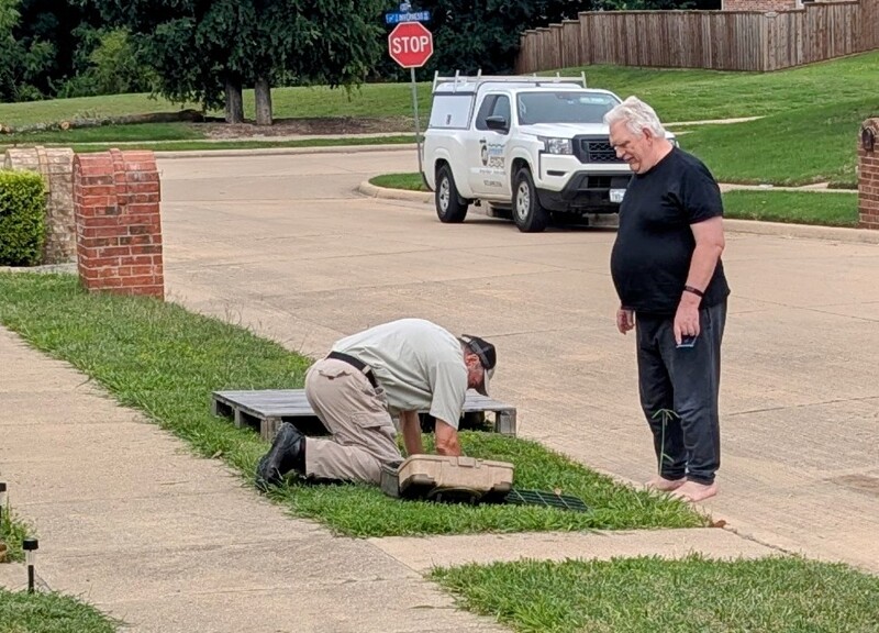 Don and repairman doing the backflow check.  Sadly we failed this year.