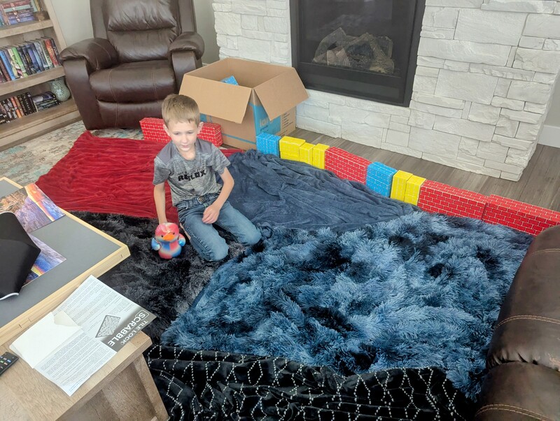 Austin and his play area. He made a nice patchwork on the floor.