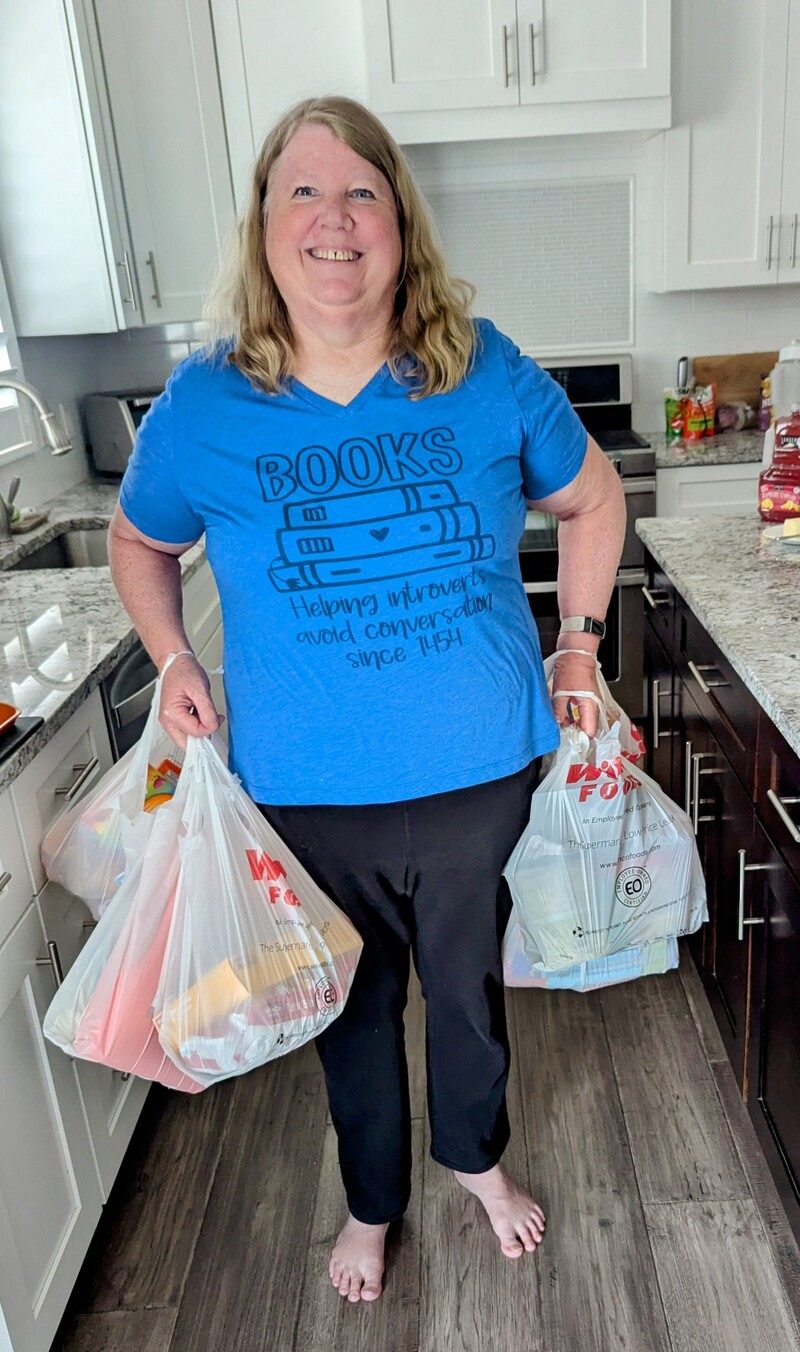 Super Woman with a gazillion food bags